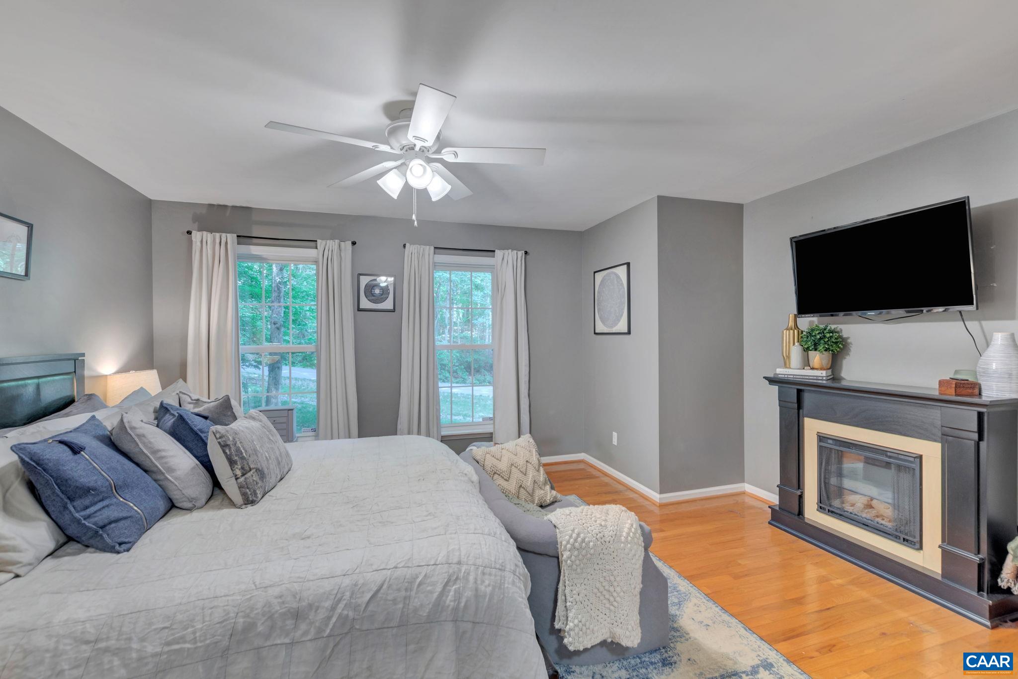 9 Colonial Road Palmyra, VA 22963 - Photo 21 of 49 a bedroom with a bed and a flat screen tv