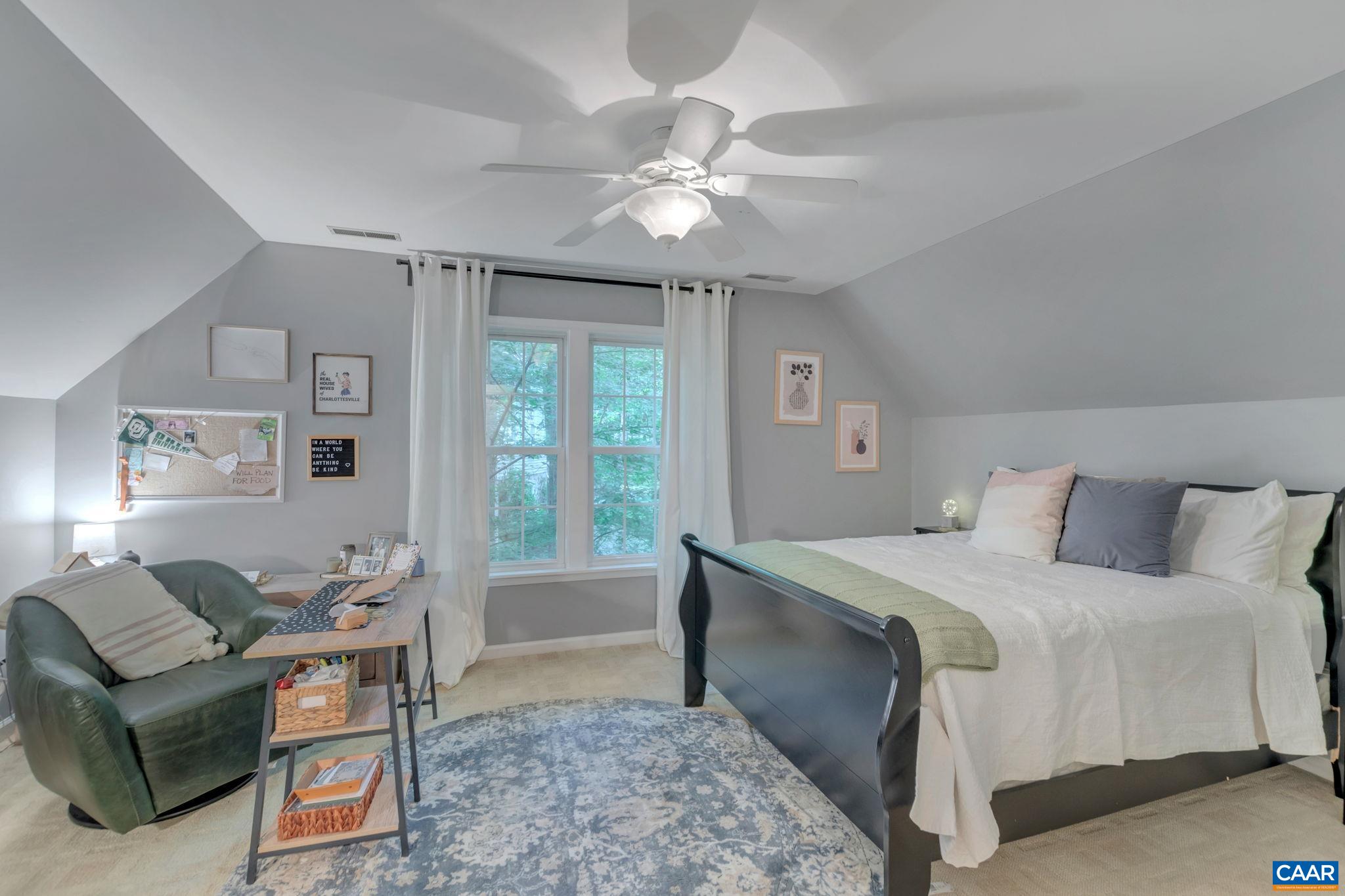 9 Colonial Road Palmyra, VA 22963 - Photo 24 of 49 a spacious bedroom with a bed and a chandelier