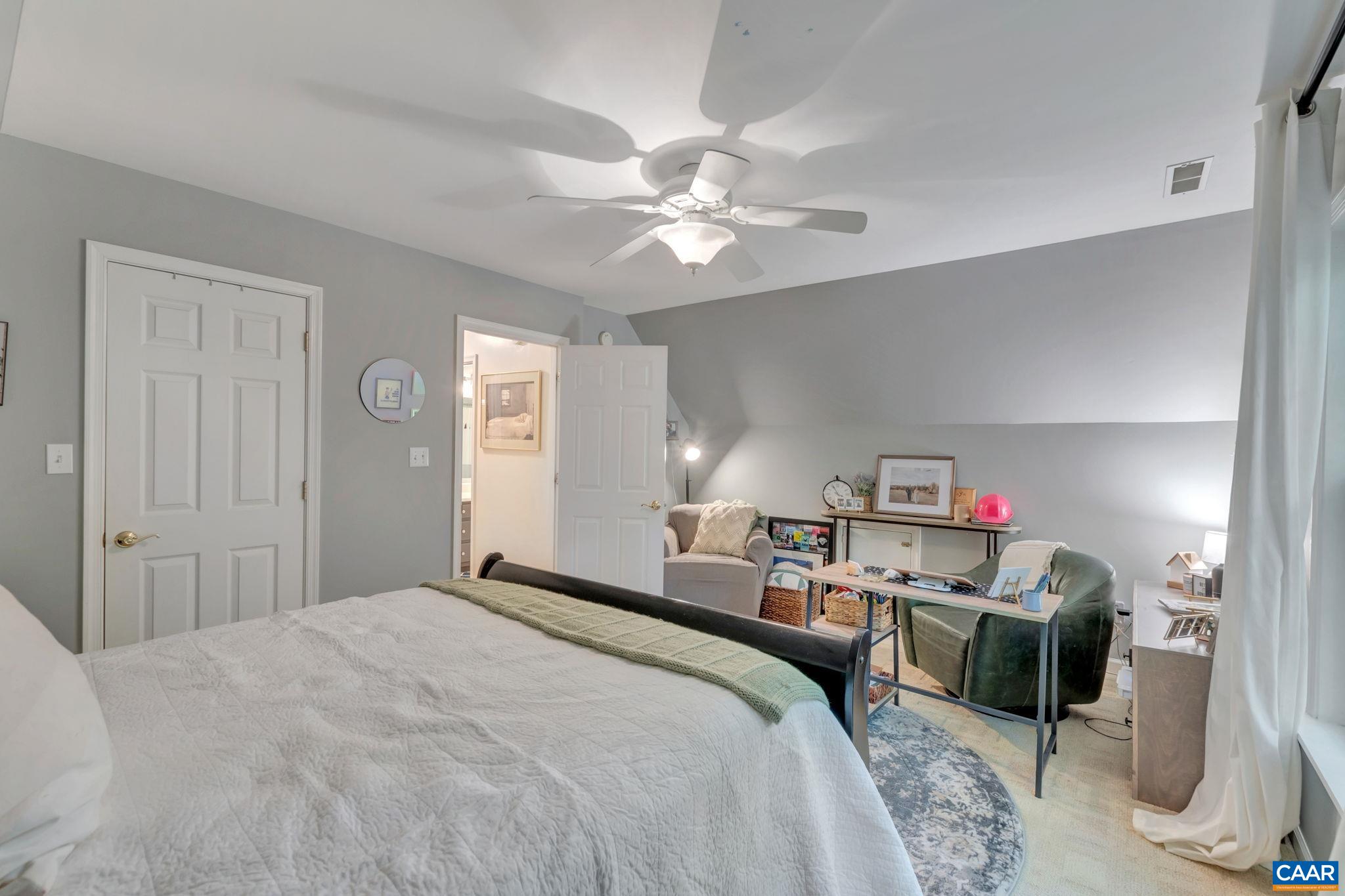 9 Colonial Road Palmyra, VA 22963 - Photo 25 of 49 a bedroom with a bed and a chandelier