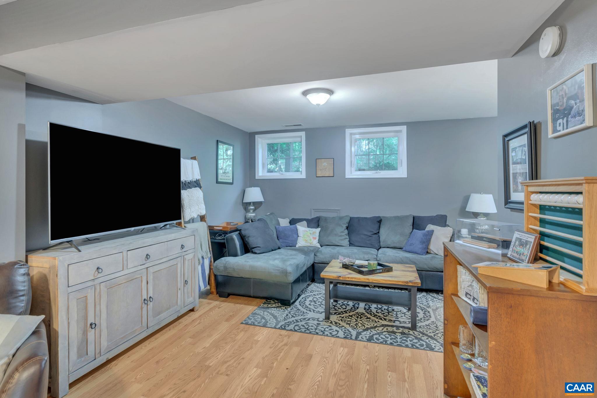 9 Colonial Road Palmyra, VA 22963 - Photo 32 of 49 a living room with furniture and a flat screen tv