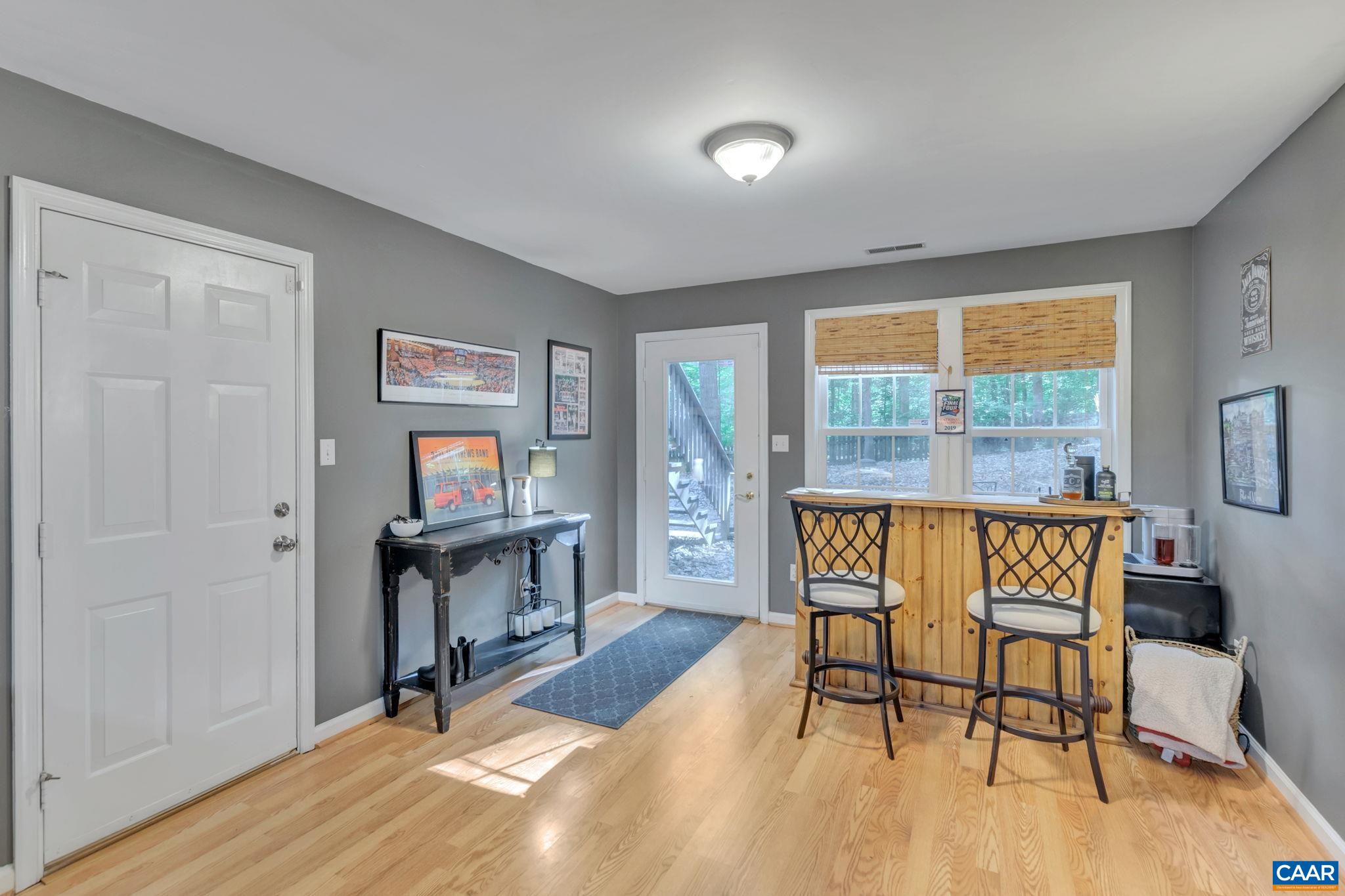 9 Colonial Road Palmyra, VA 22963 - Photo 34 of 49 a dining room with furniture windows and wooden floor