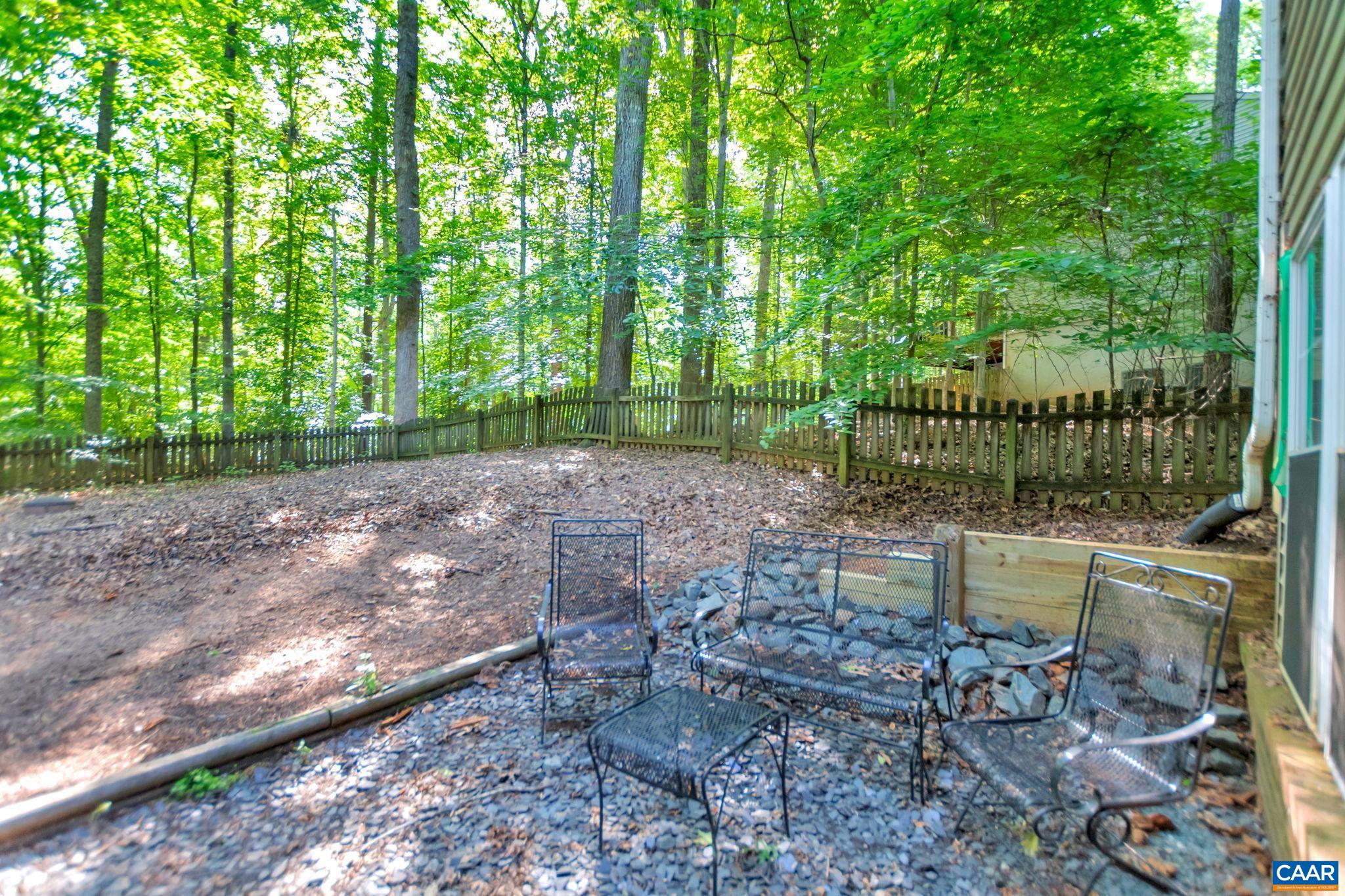 9 Colonial Road Palmyra, VA 22963 - Photo 43 of 49 a view of a yard with a bench and some trees