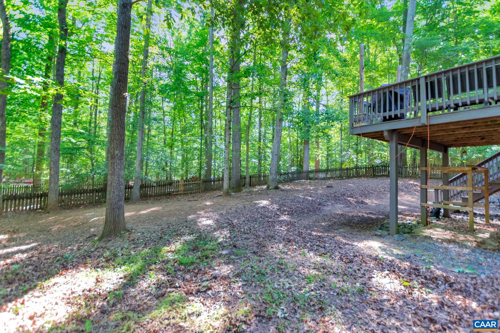 9 Colonial Road Palmyra, VA 22963 - Photo 45 of 49 a view of a wooden deck with a yard