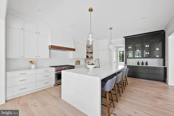 a living room with furniture a fireplace and a floor to ceiling window