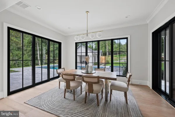 a kitchen with stainless steel appliances kitchen island granite countertop a stove a sink and a refrigerator