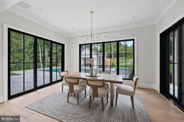 a kitchen with stainless steel appliances kitchen island granite countertop a stove a sink and a refrigerator