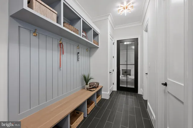 a living room with furniture large windows and fireplace