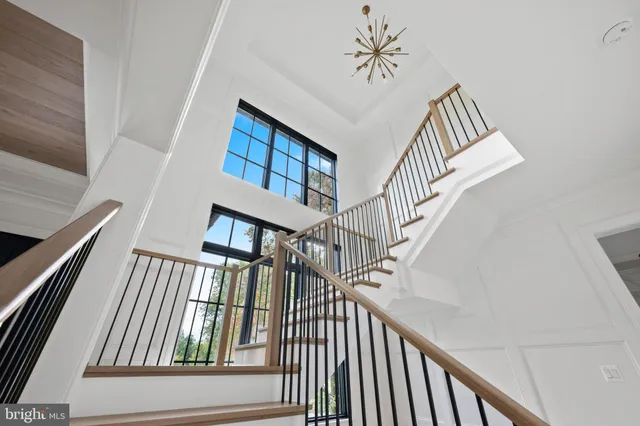 a kitchen with stainless steel appliances a sink a stove and a refrigerator