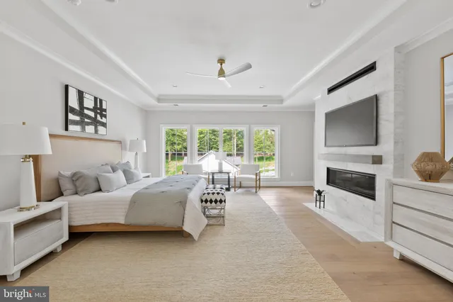 a hallway with front door wooden floor and stairs
