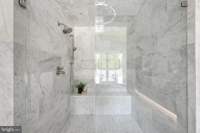 a spacious bedroom with a bed and a fireplace