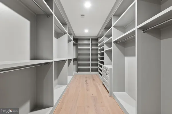 a spacious bathroom with a bathtub and a large window