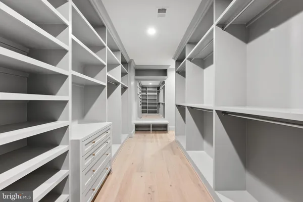 a bathroom with a double vanity sink and mirror