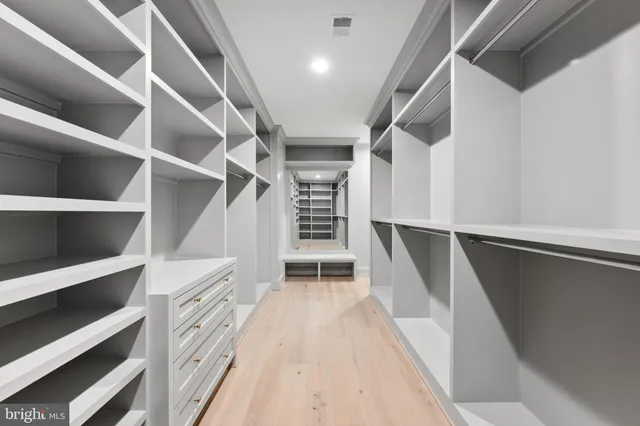 a bathroom with a double vanity sink and mirror