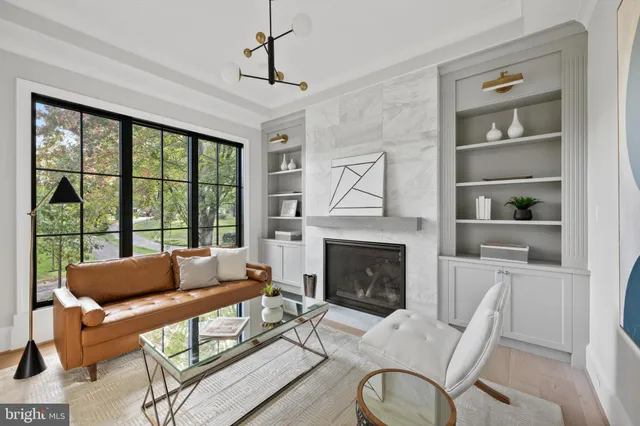 a view of entryway and hall with a floor to ceiling window