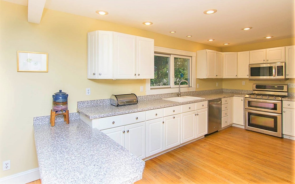 8 Framar Road Wellesley, MA 02481 - Photo 12 of 30 a kitchen with a sink window and cabinets