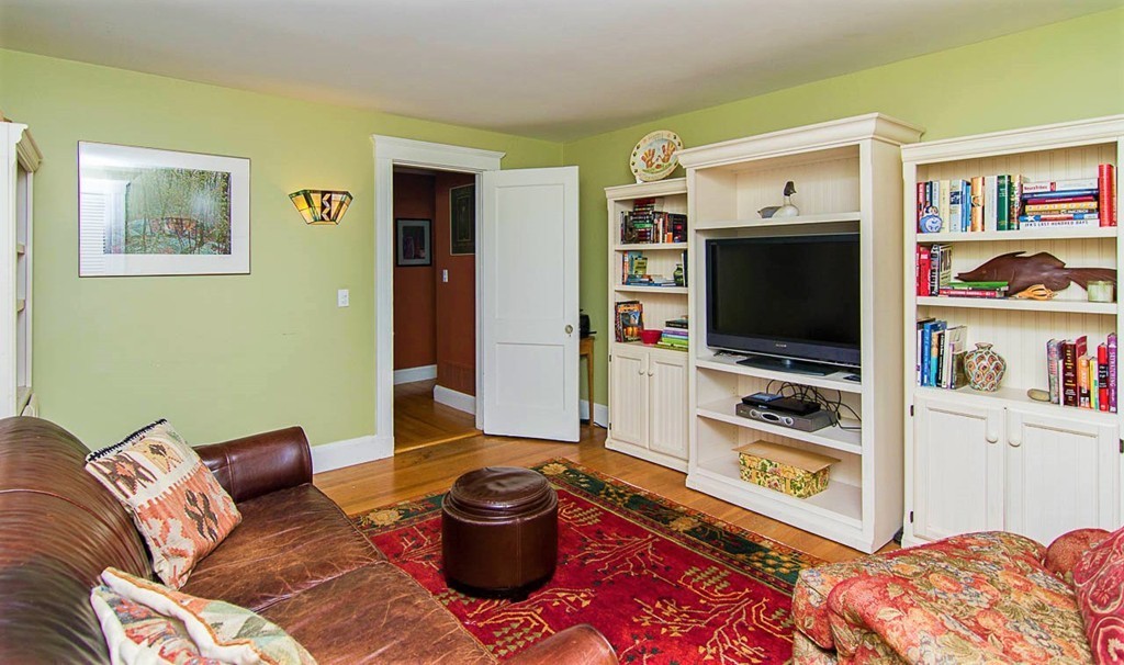 8 Framar Road Wellesley, MA 02481 - Photo 16 of 30 a living room with furniture and a flat screen tv