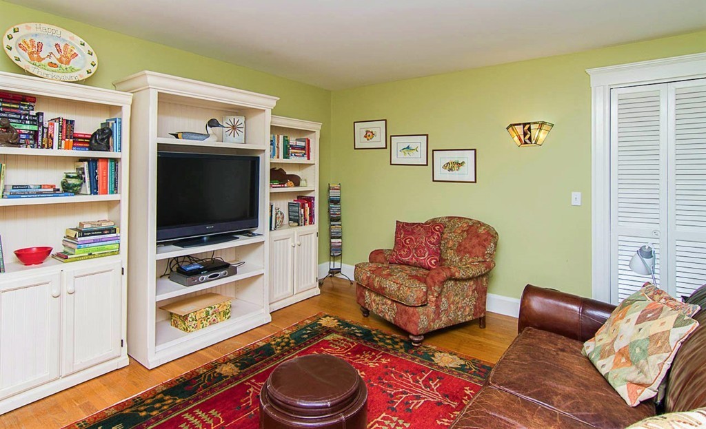 8 Framar Road Wellesley, MA 02481 - Photo 18 of 30 a living room with furniture and a flat screen tv