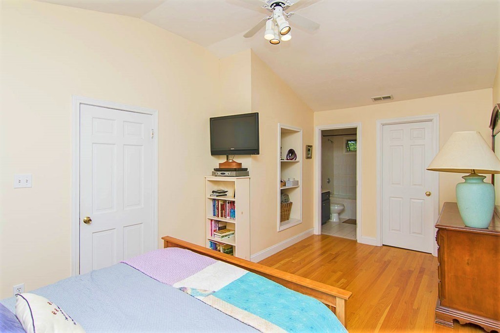 8 Framar Road Wellesley, MA 02481 - Photo 21 of 30 a bedroom with furniture and a flat screen tv