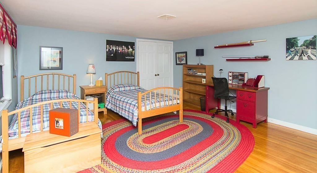 8 Framar Road Wellesley, MA 02481 - Photo 22 of 30 a bedroom with a bed and wooden floor