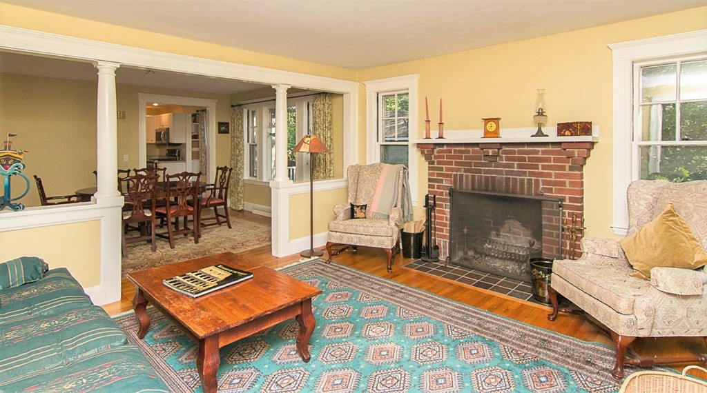 8 Framar Road Wellesley, MA 02481 - Photo 4 of 30 a living room with furniture a rug and a fireplace