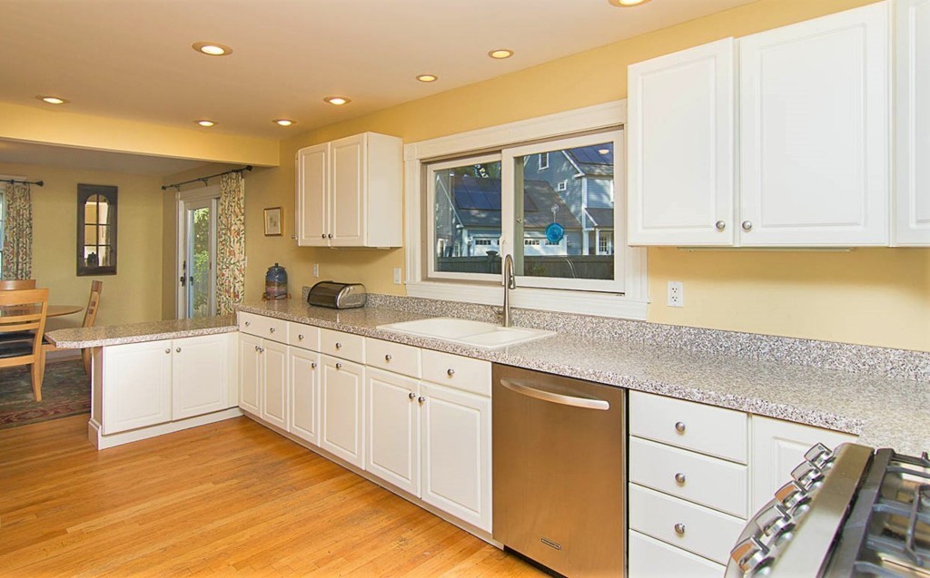 8 Framar Road Wellesley, MA 02481 - Photo 8 of 30 a kitchen with granite countertop white cabinets and white appliances