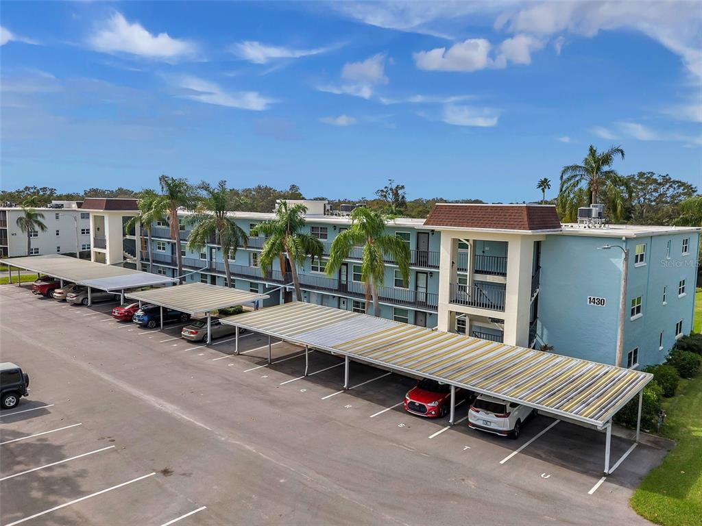 1430 Heather Ridge Boulevard, Unit 304 Dunedin, FL 34698 - Photo 31 of 36 a view of a terrace with sitting area