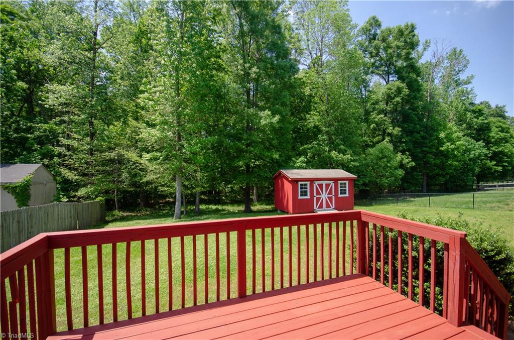 300 Falcon Road Gibsonville, NC 27249 - Photo 27 of 29 Newly painted deck with wooded view.