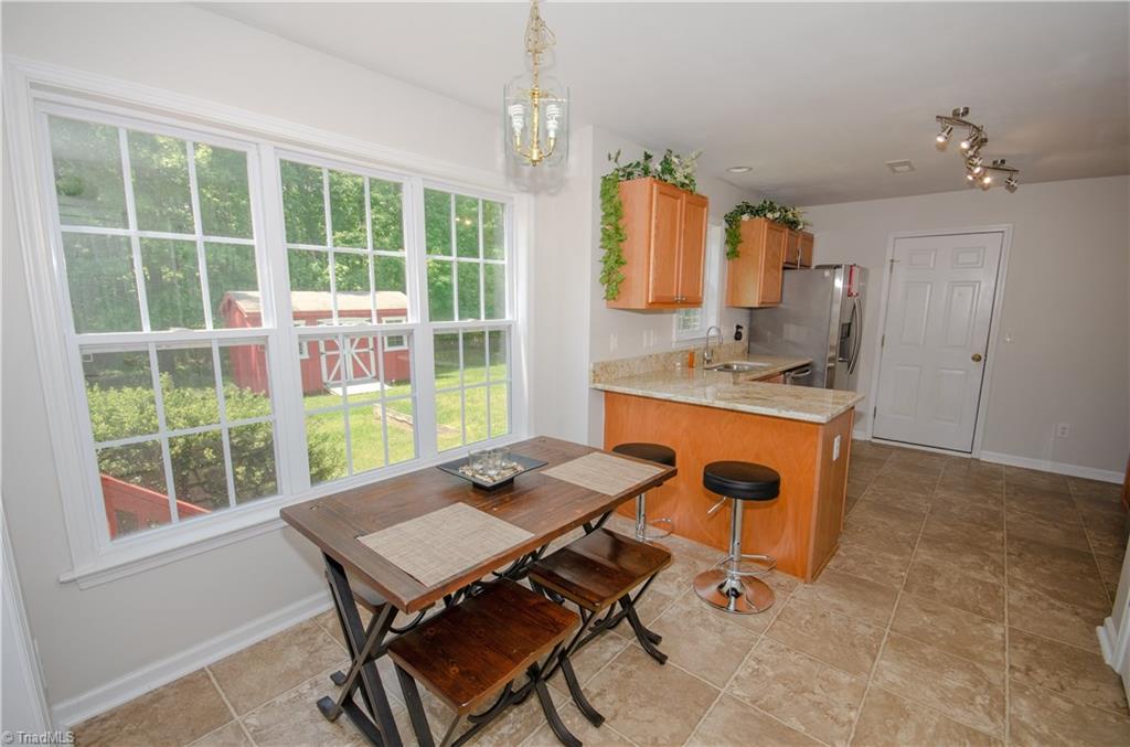 300 Falcon Road Gibsonville, NC 27249 - Photo 7 of 29 Eat in kitchen with hang over bar area