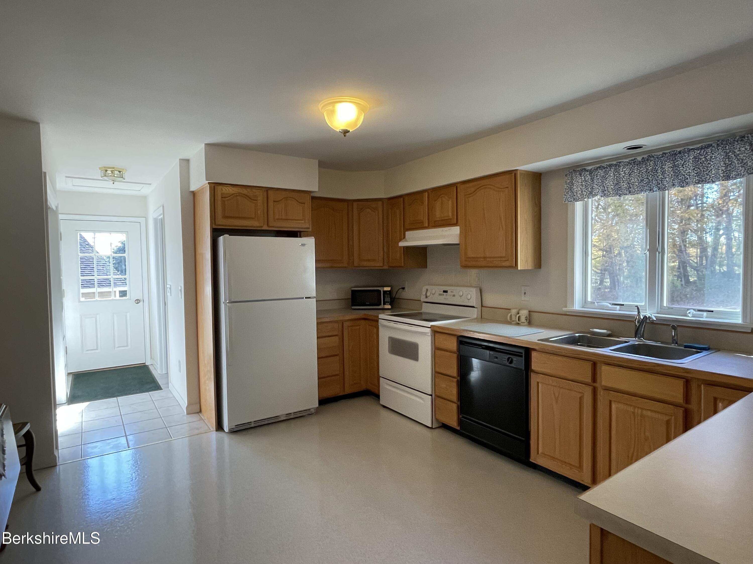 181 Main Road Monterey, MA 01230 - Photo 3 of 63 a kitchen with a sink refrigerator and cabinets