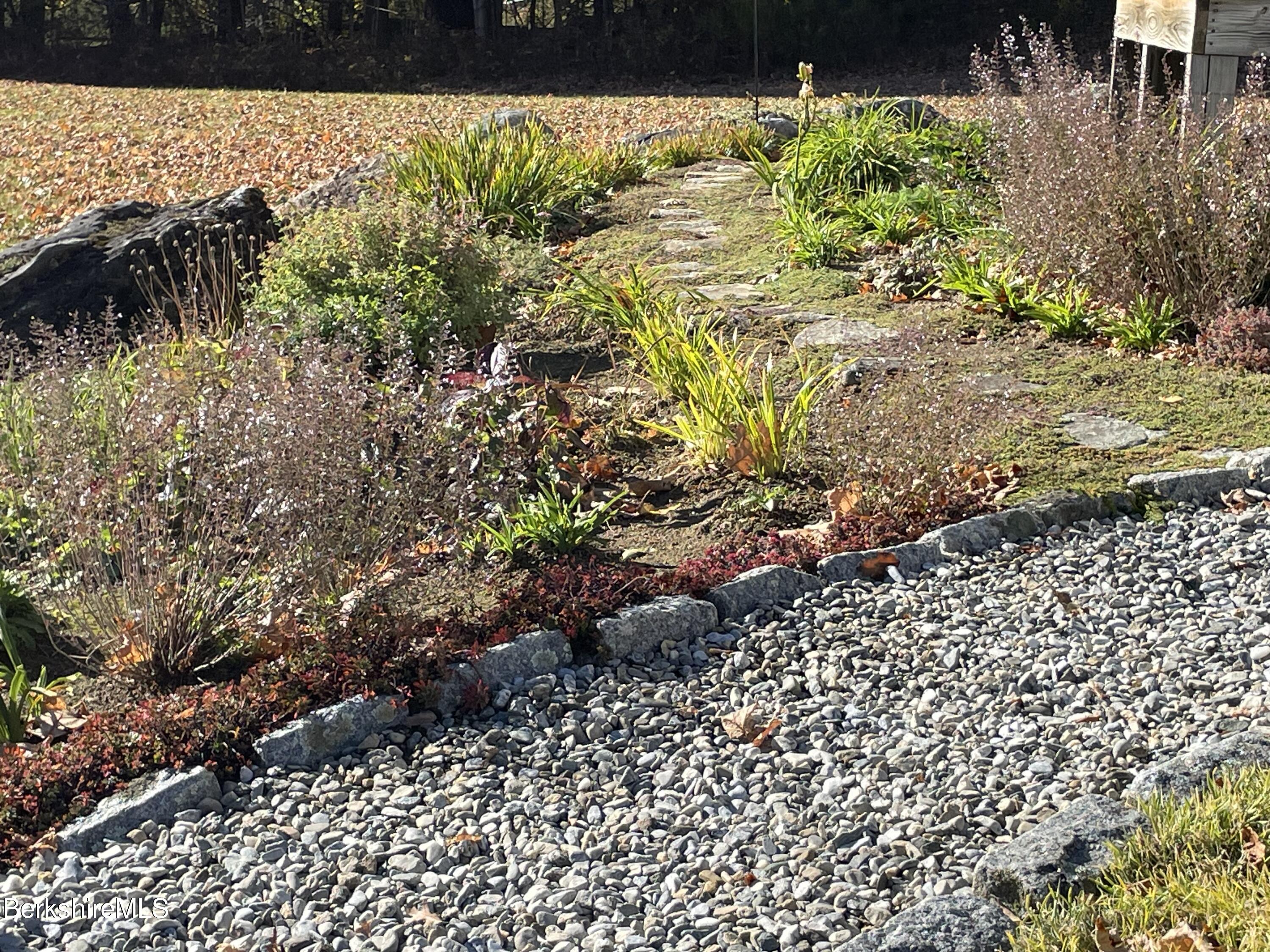 181 Main Road Monterey, MA 01230 - Photo 37 of 63 a view of a garden with a pathway