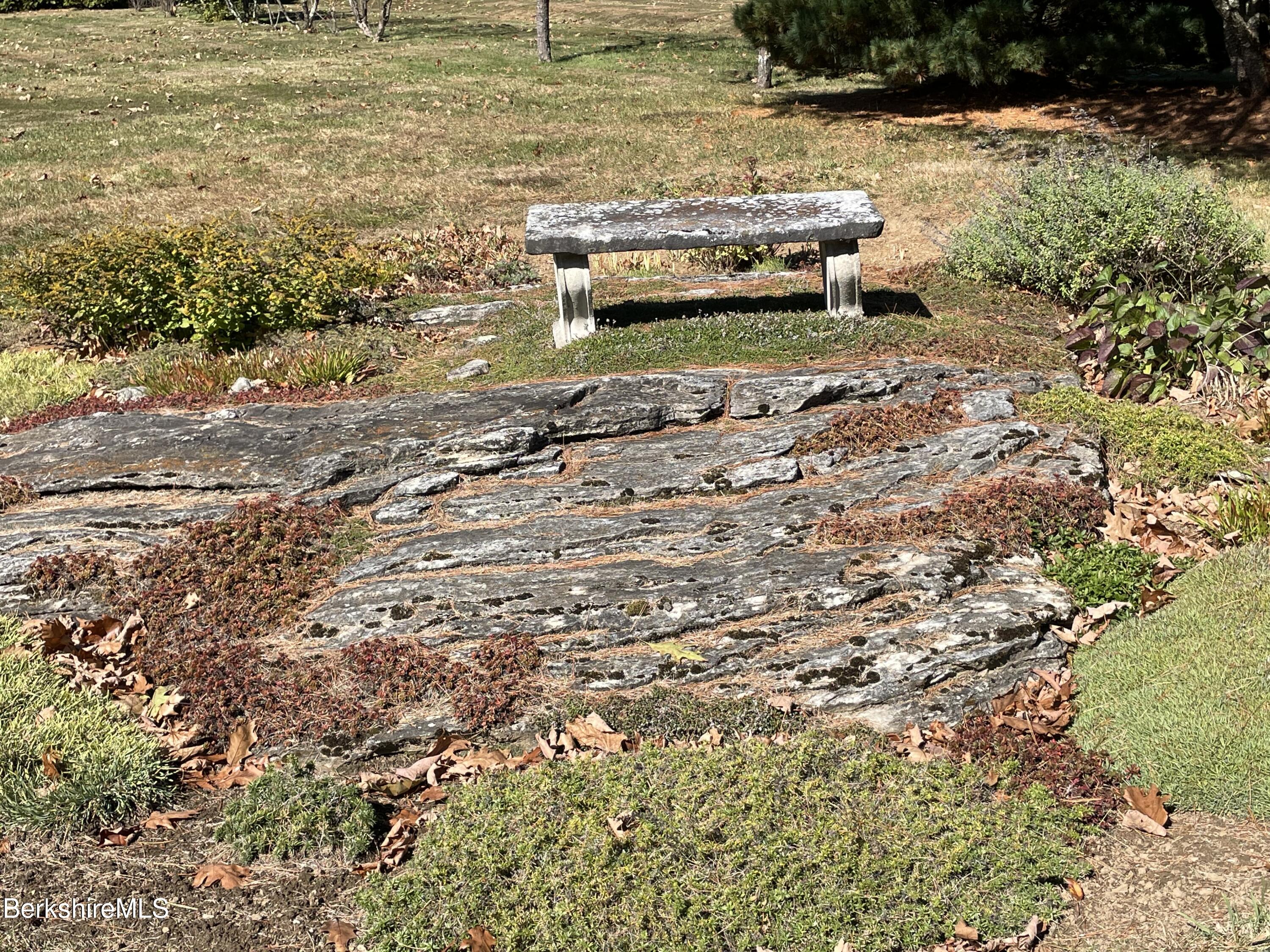 181 Main Road Monterey, MA 01230 - Photo 40 of 63 a view of a backyard with lawn chairs