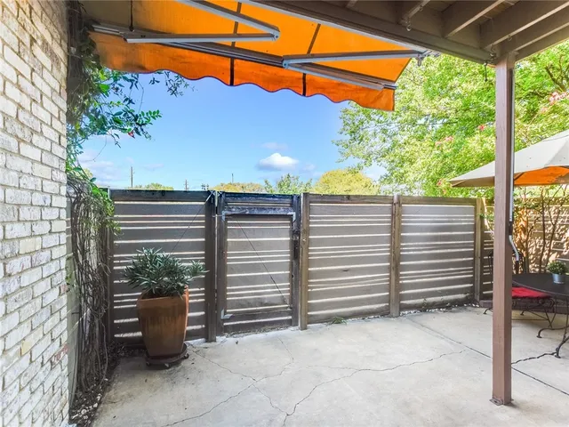 a view of an house with swimming pool and sitting area