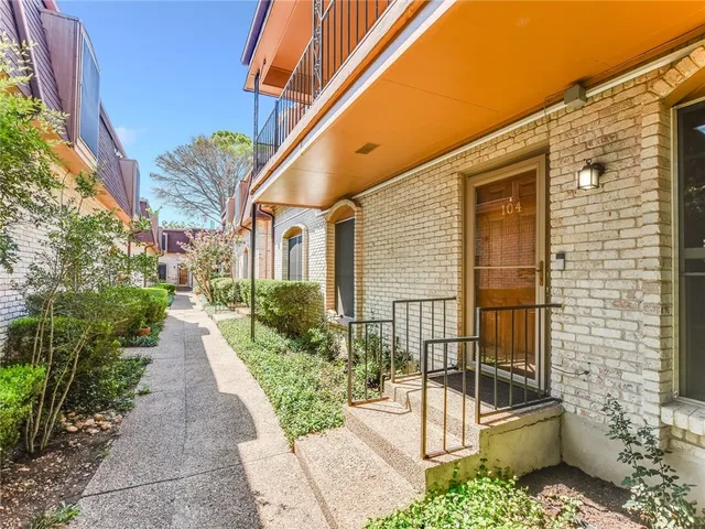 a view of a pathway with a patio
