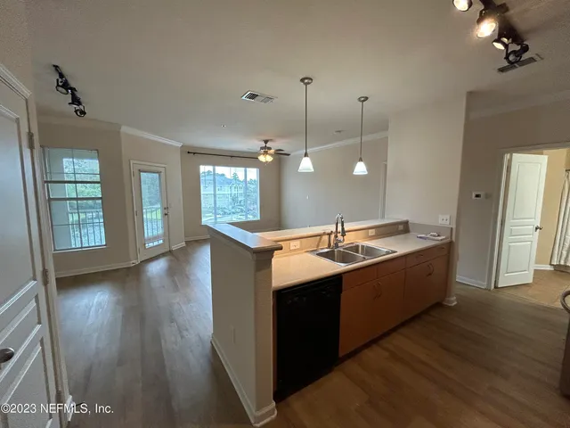 a large bathroom with a sink vanity granite tub and shower
