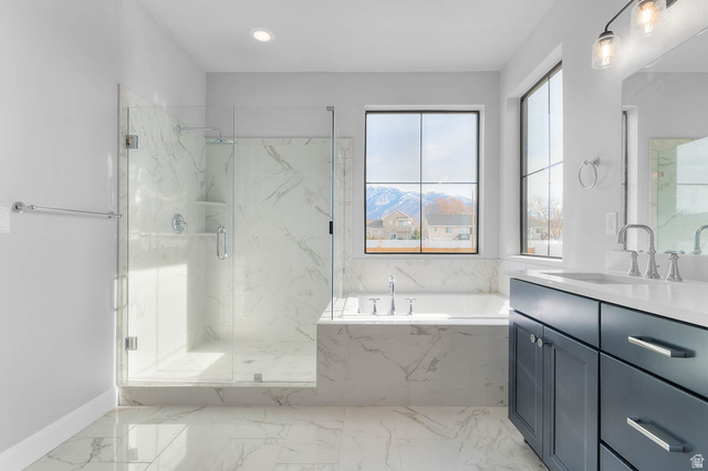 11673 South Halls Crk Road Draper, UT 84020 - Photo 20 of 22 Spacious bathroom featuring a glass-enclosed shower, a separate soaking tub, and a dual vanity with dark cabinetry