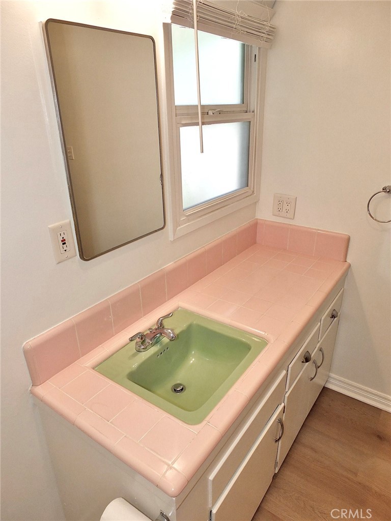 1808 East Appleton Street, Unit 7 Long Beach, CA 90802 - Photo 29 of 44 a bathroom with a sink and a mirror
