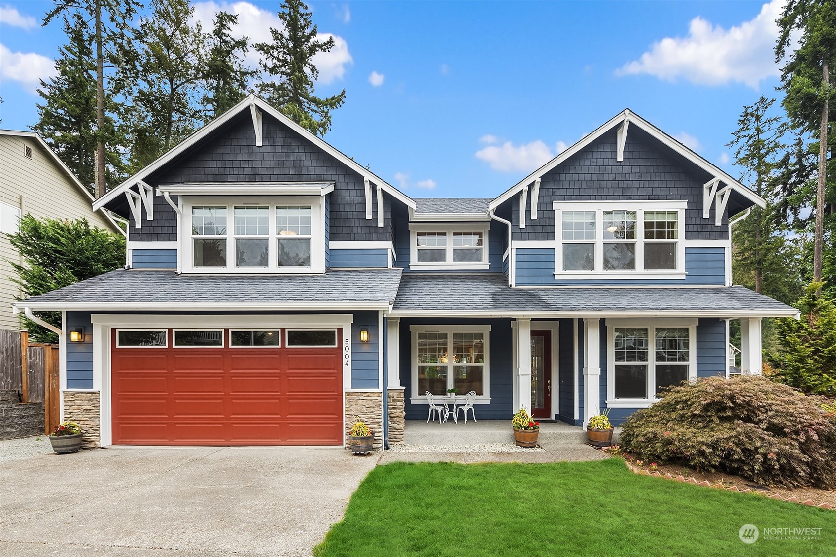 5004 Northeast 25th Street Renton, WA 98059 - Photo 1 of 37 a front view of a house with garden