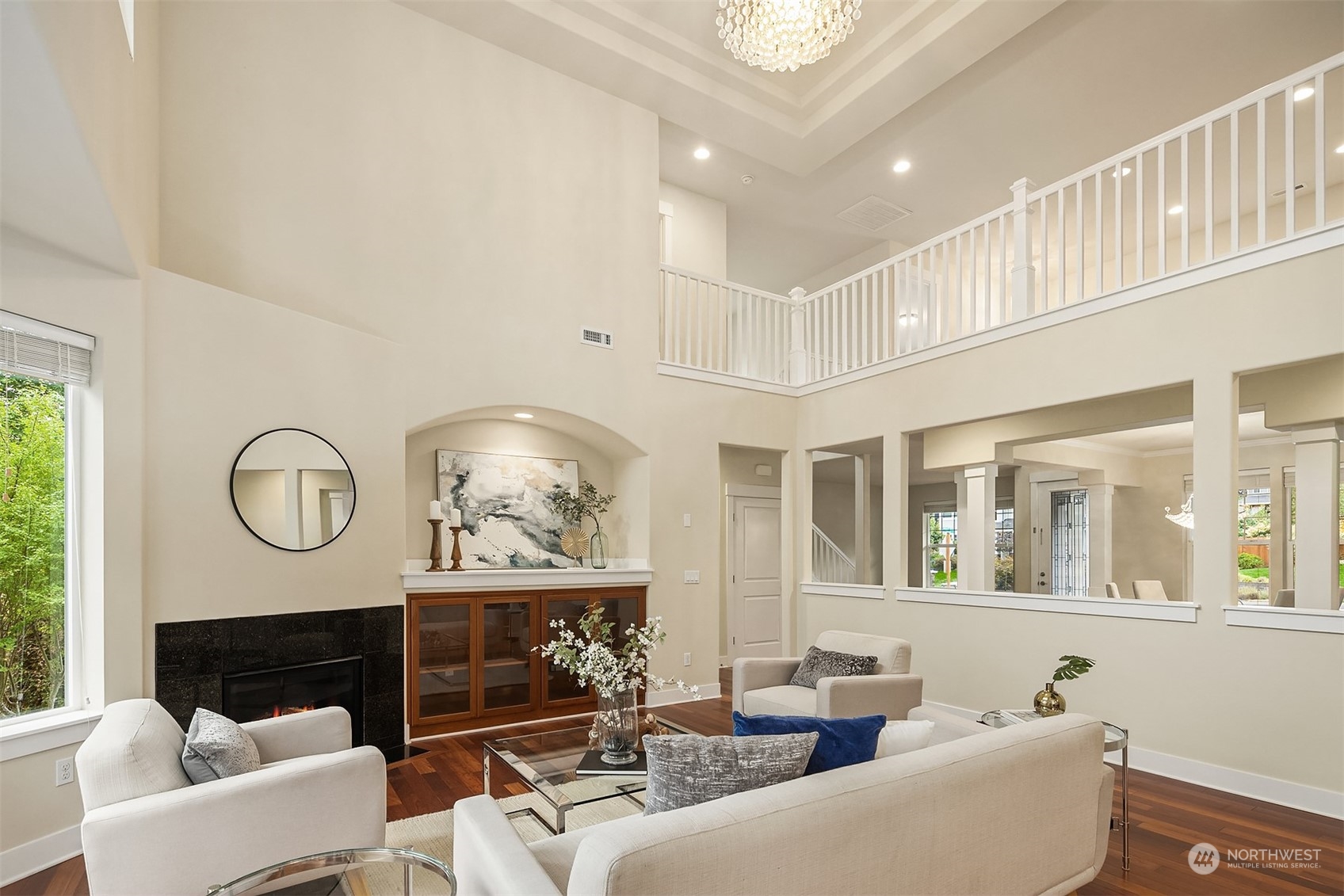 5004 Northeast 25th Street Renton, WA 98059 - Photo 11 of 37 a living room with furniture a fireplace and a large window