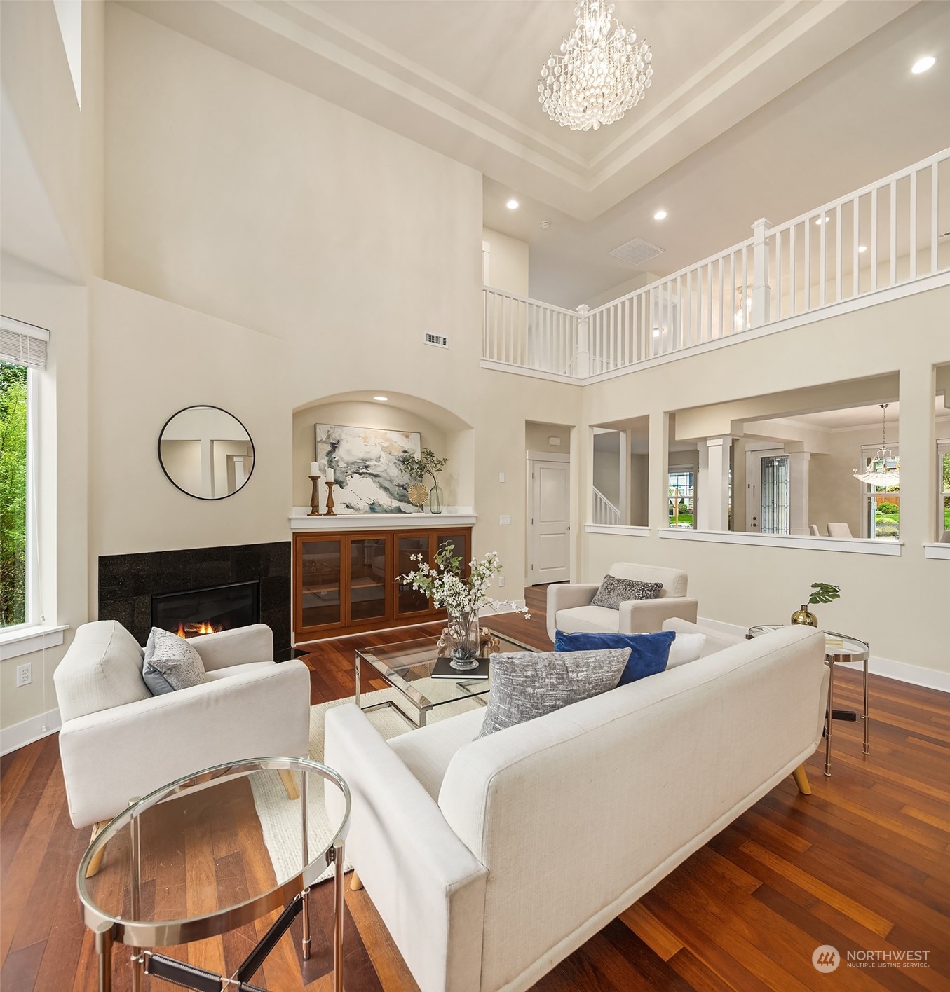 5004 Northeast 25th Street Renton, WA 98059 - Photo 12 of 37 a living room with fireplace furniture and a chandelier