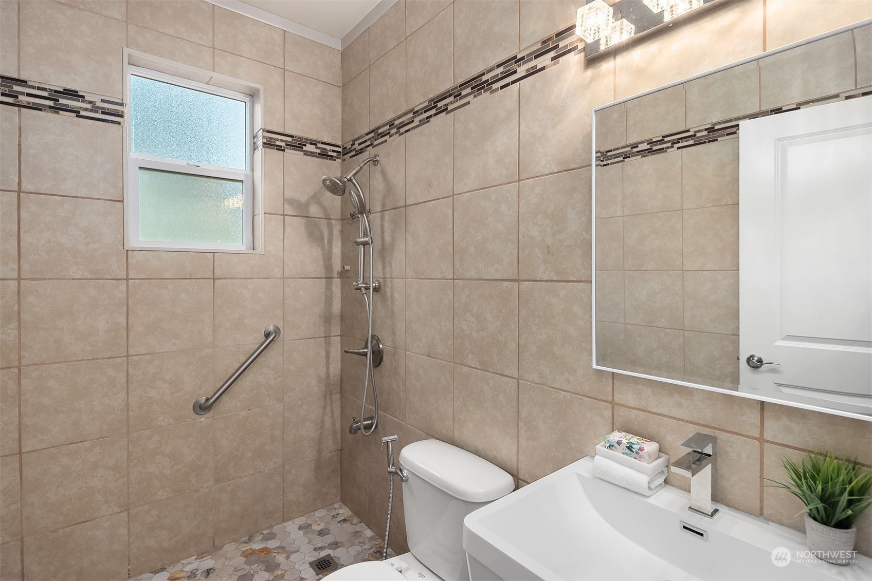 5004 Northeast 25th Street Renton, WA 98059 - Photo 23 of 37 a bathroom with a shower toilet and sink