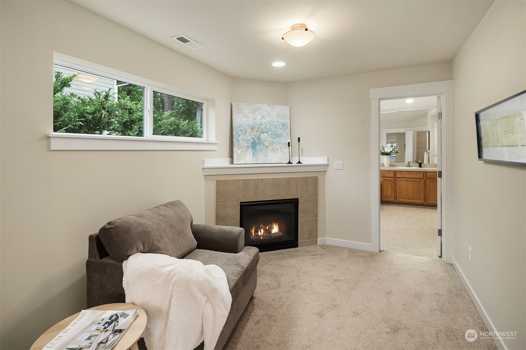 5004 Northeast 25th Street Renton, WA 98059 - Photo 28 of 37 a living room with furniture and a fireplace