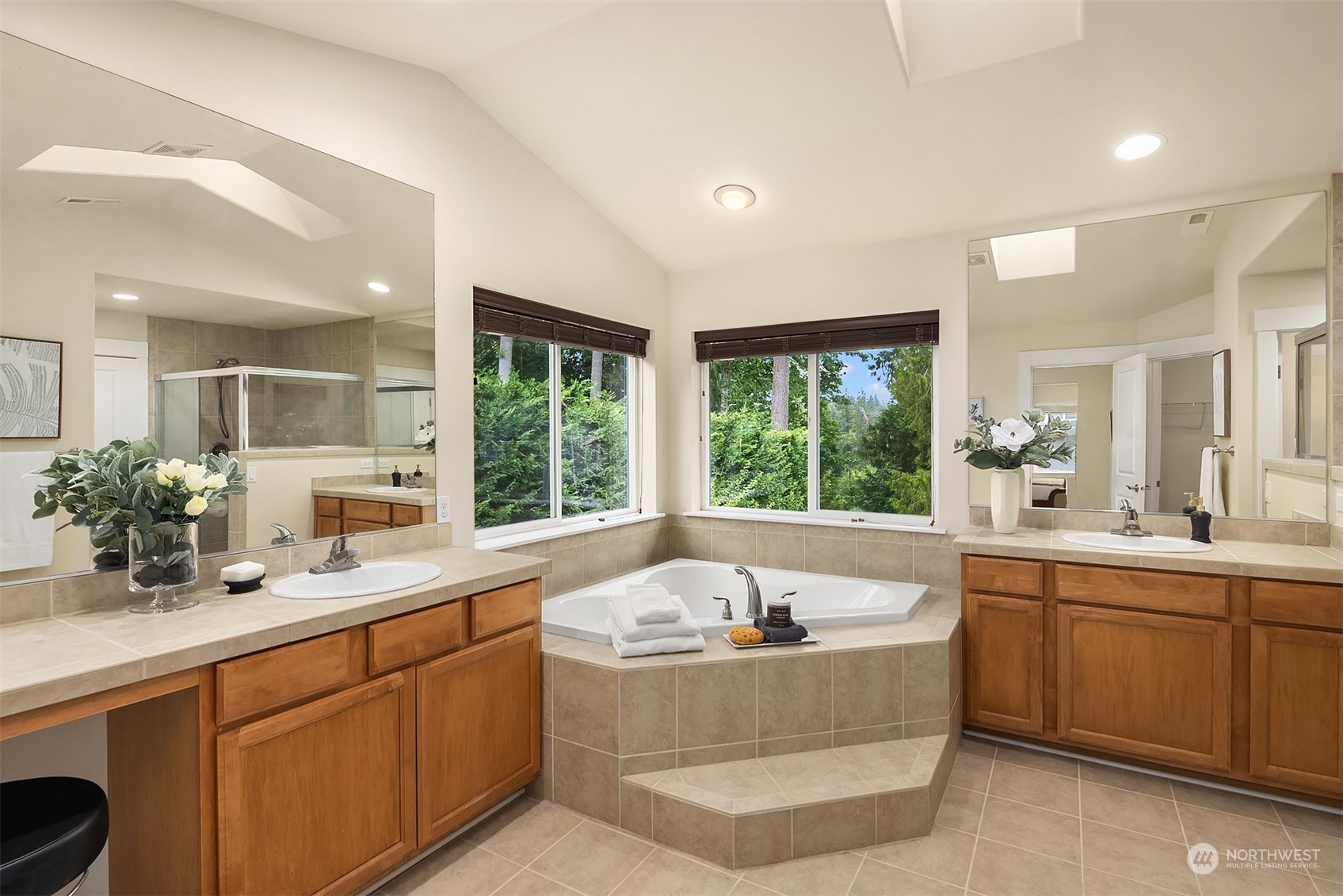 5004 Northeast 25th Street Renton, WA 98059 - Photo 29 of 37 a spacious bathroom with a large tub sink and mirror