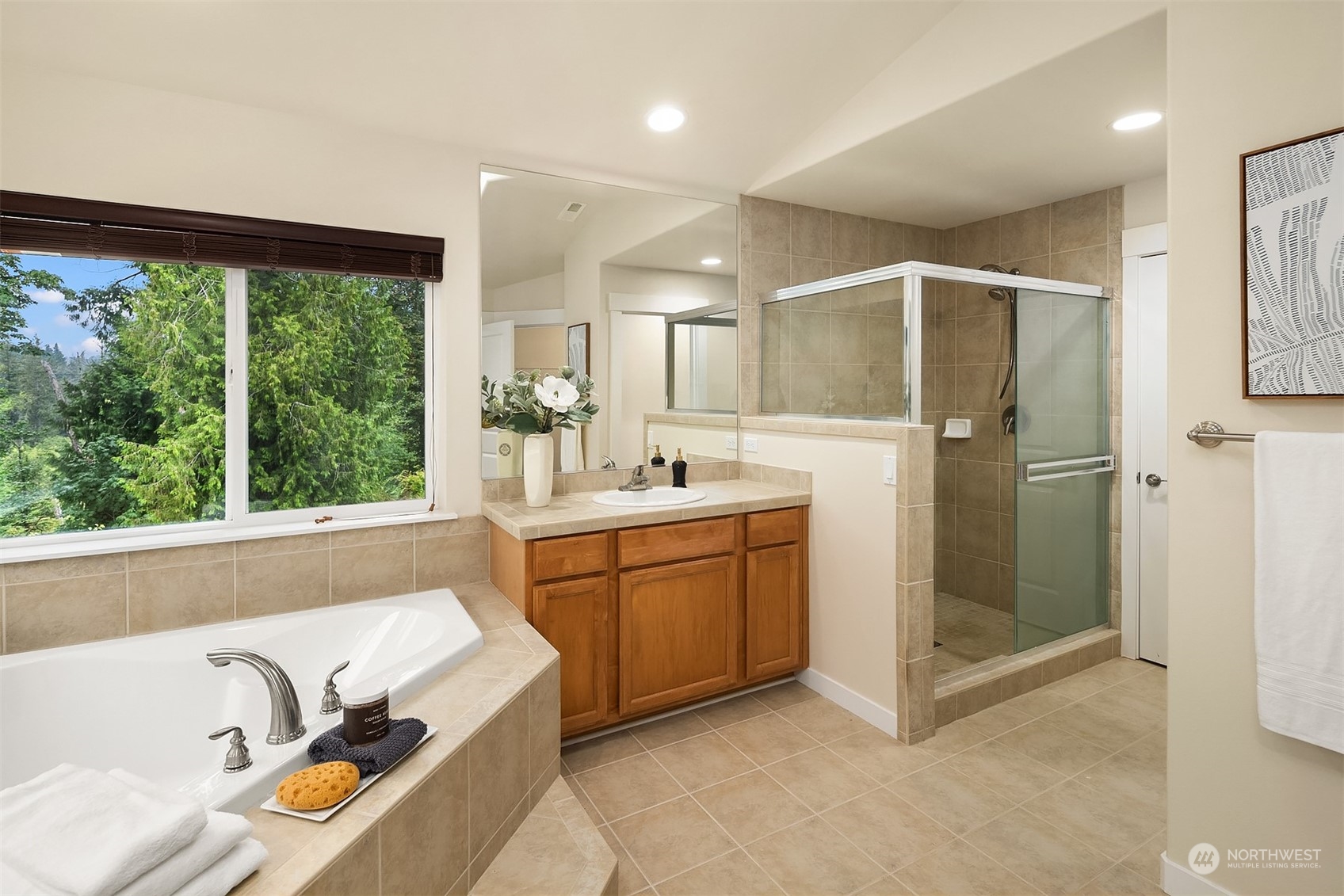5004 Northeast 25th Street Renton, WA 98059 - Photo 30 of 37 a bathroom with a tub sink shower and mirror