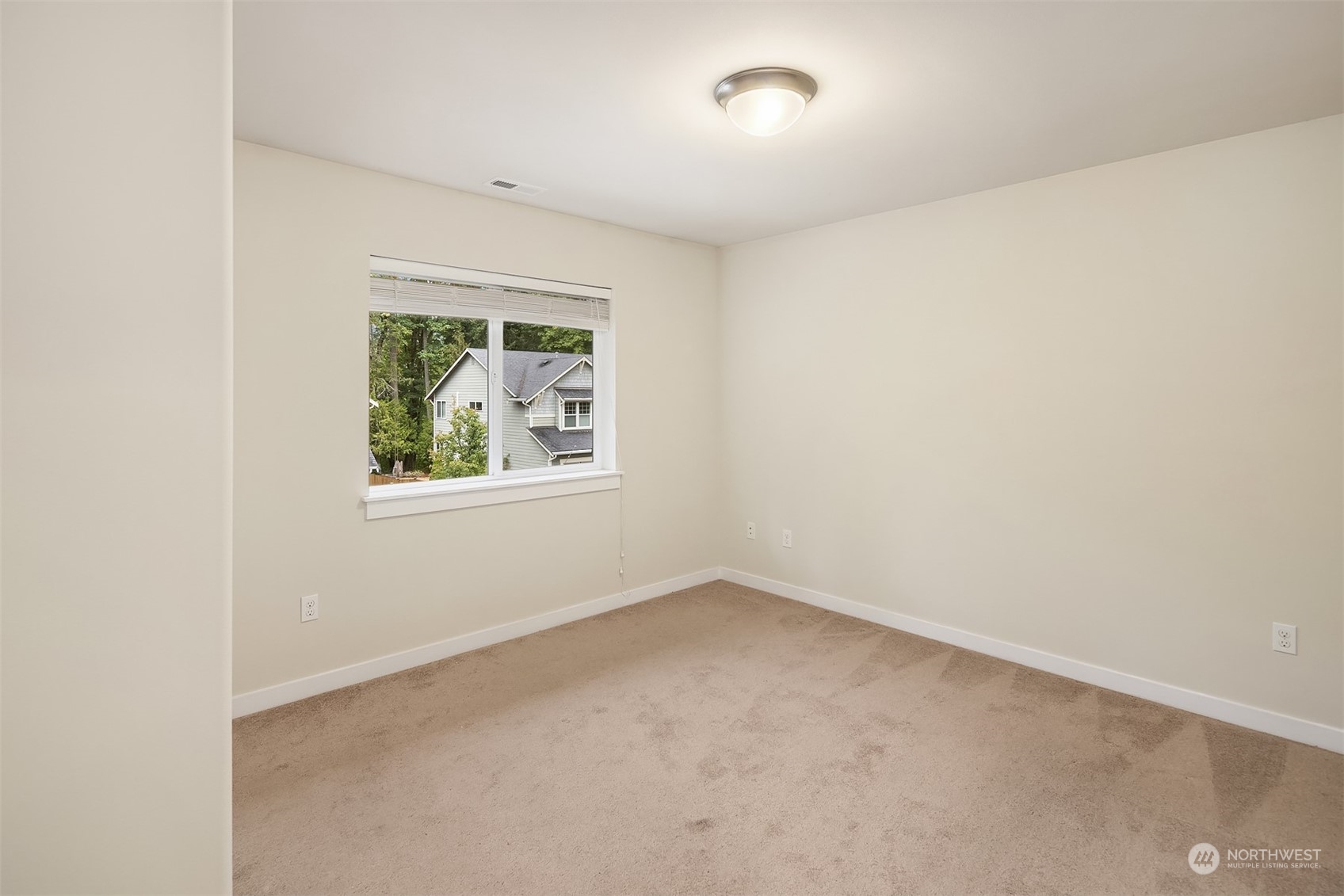 5004 Northeast 25th Street Renton, WA 98059 - Photo 32 of 37 an empty room with a window