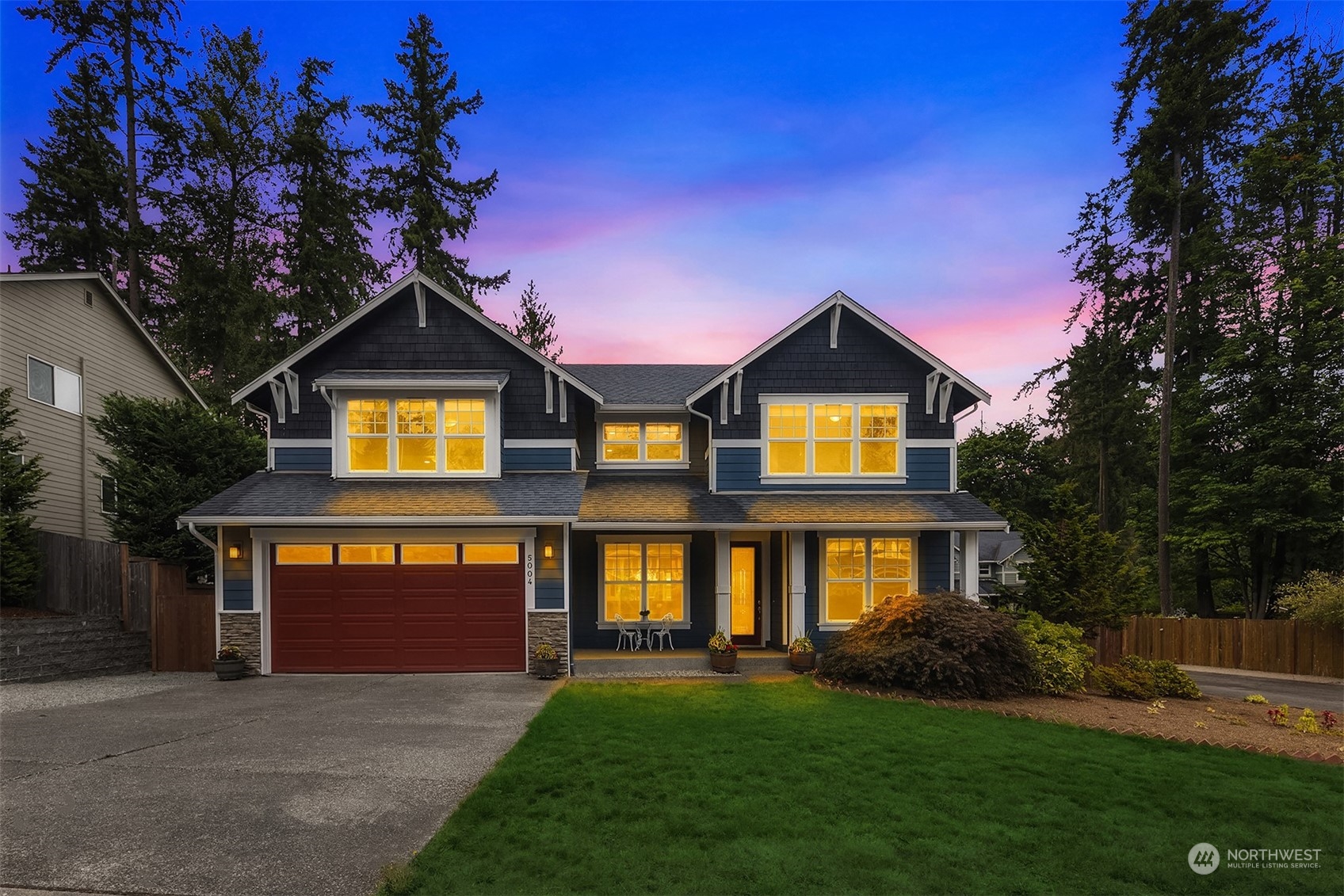 5004 Northeast 25th Street Renton, WA 98059 - Photo 4 of 37 a front view of a house with a yard