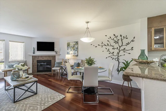 a living room with furniture fireplace and window