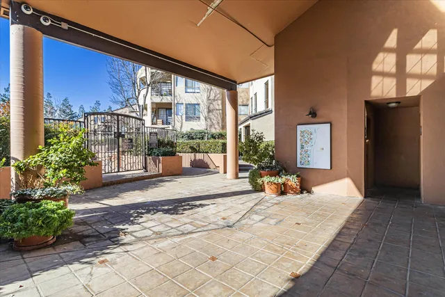a bedroom with furniture and large windows
