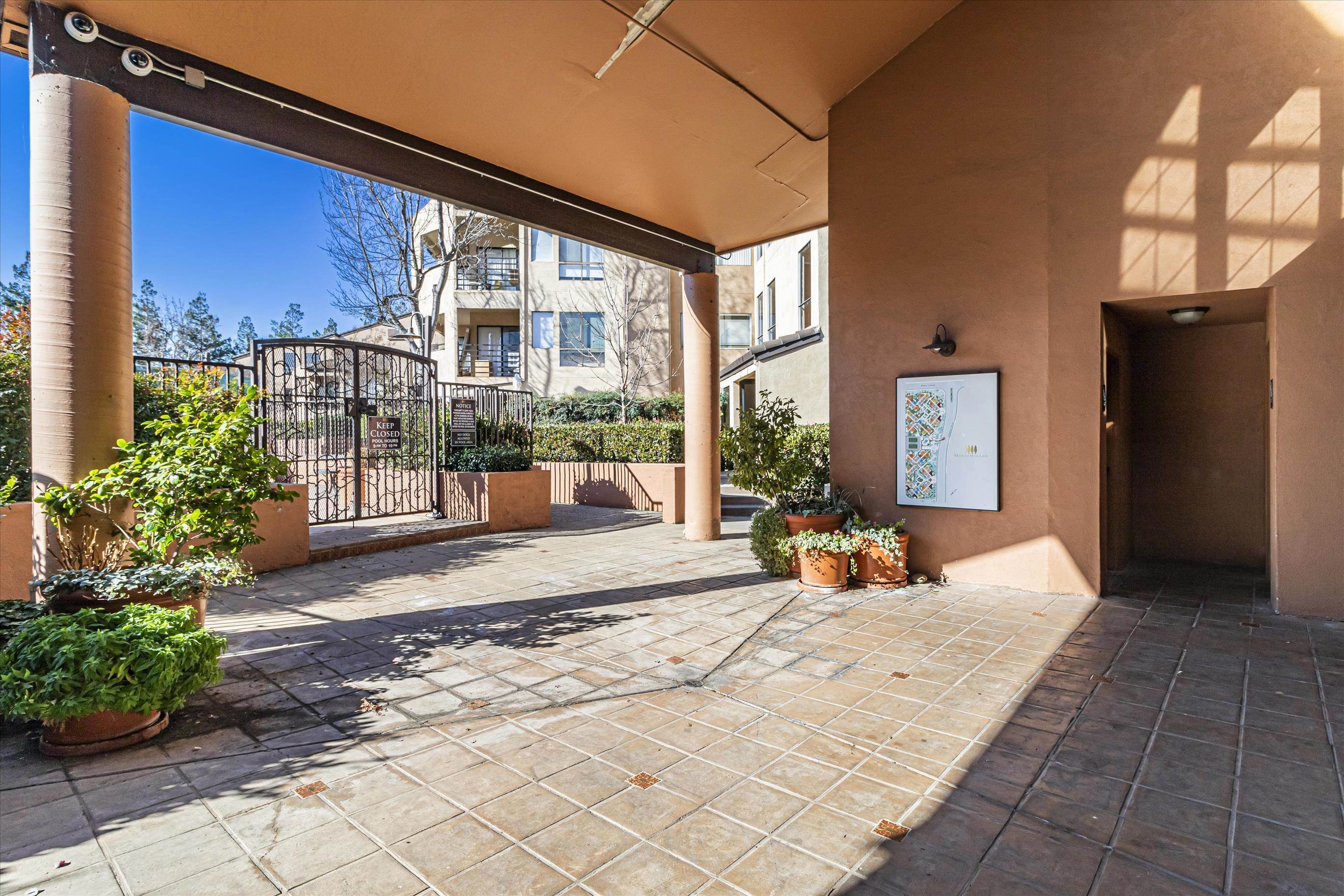 39059 Guardino Drive, Unit 206 Fremont, CA 94538 - Photo 23 of 37 a bedroom with furniture and large windows