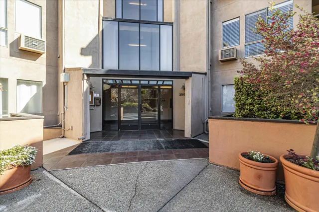 a view of a patio with table and chairs and potted plants