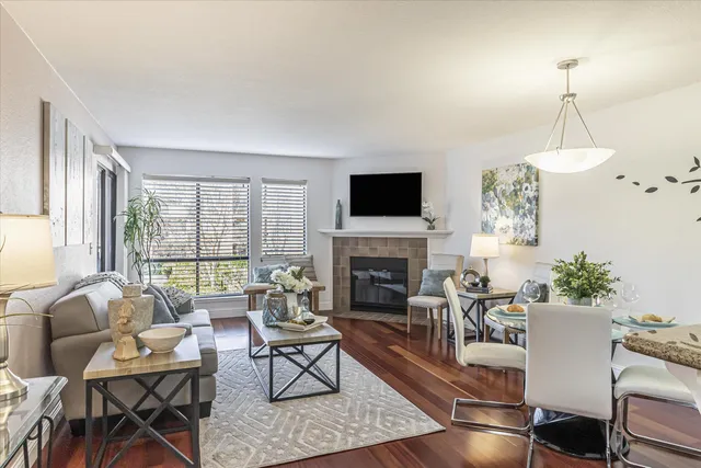 a living room with furniture fireplace and a flat screen tv